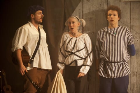 Three characters, 2 men and one woman, looking scared and shocked
