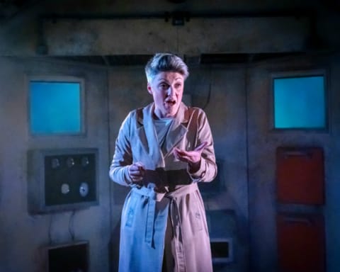 A woman in a dystopian chamber