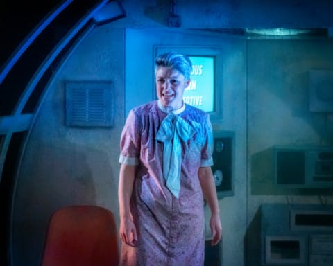 A woman in a dystopian chamber