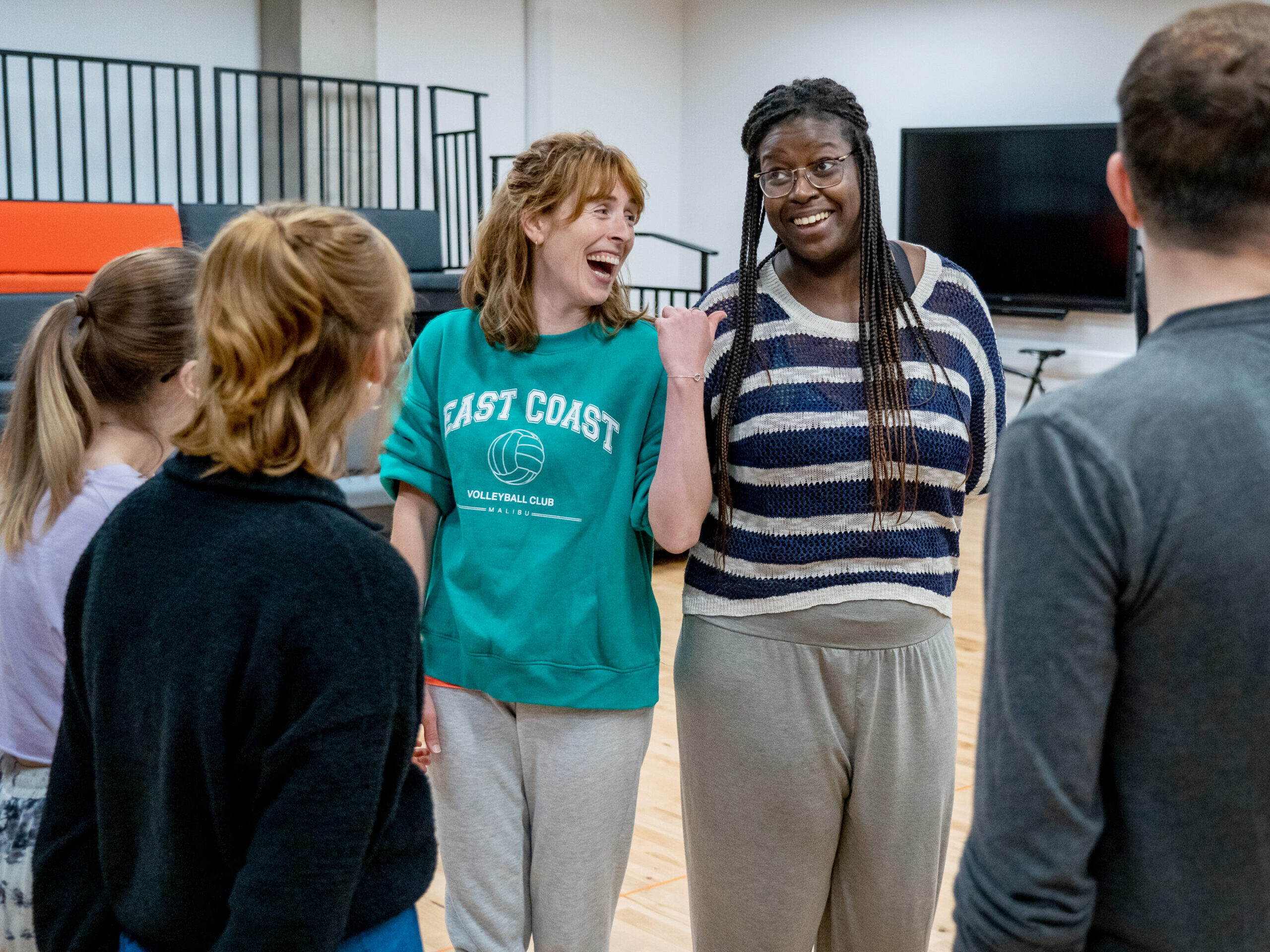 An image of participants having a laugh on the Red Grit Course