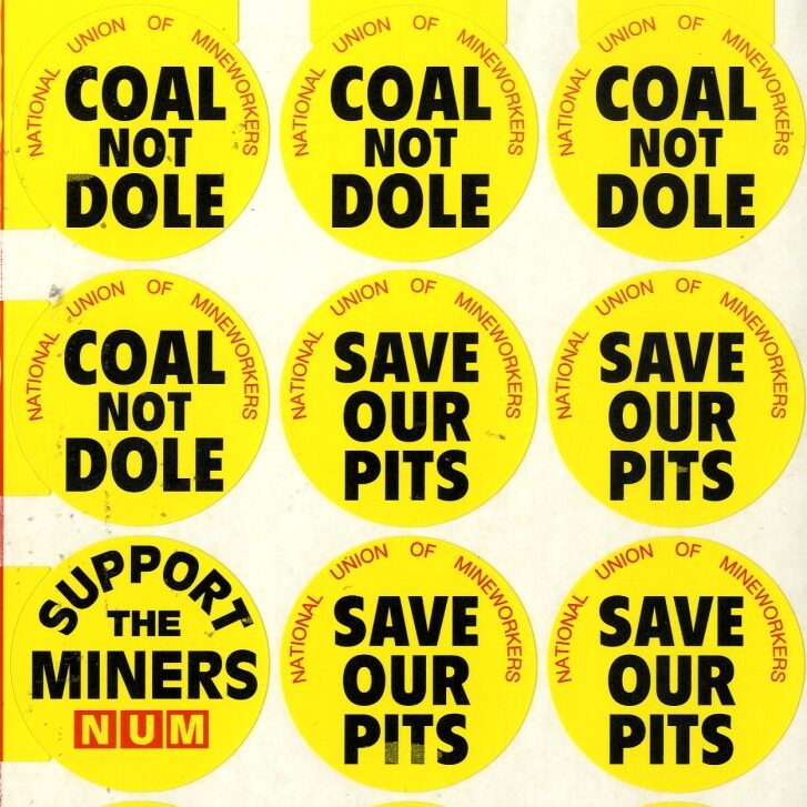 Yellow NUM stickers saying Coal not Dole