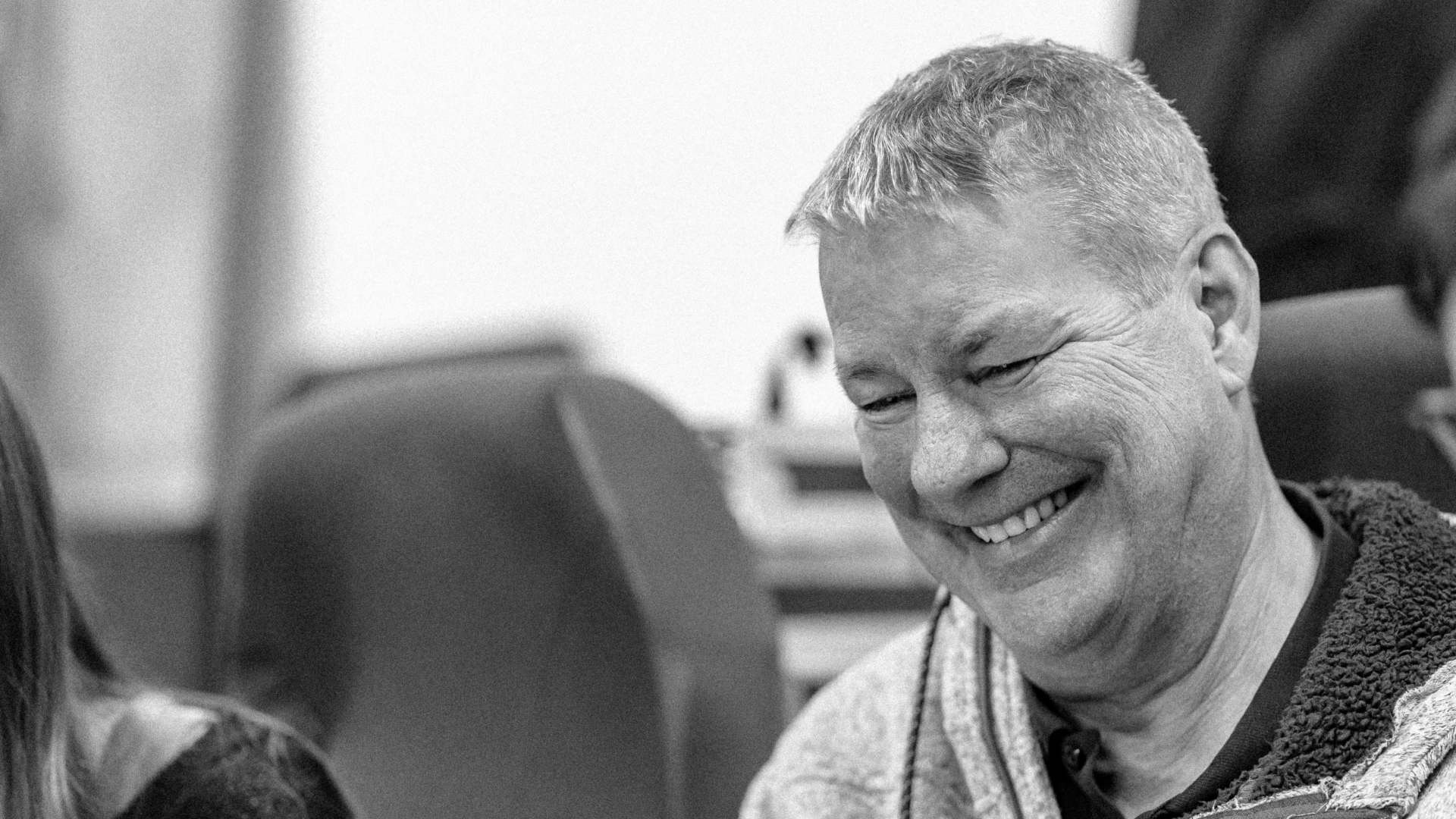 Chris in his hoodie laughing