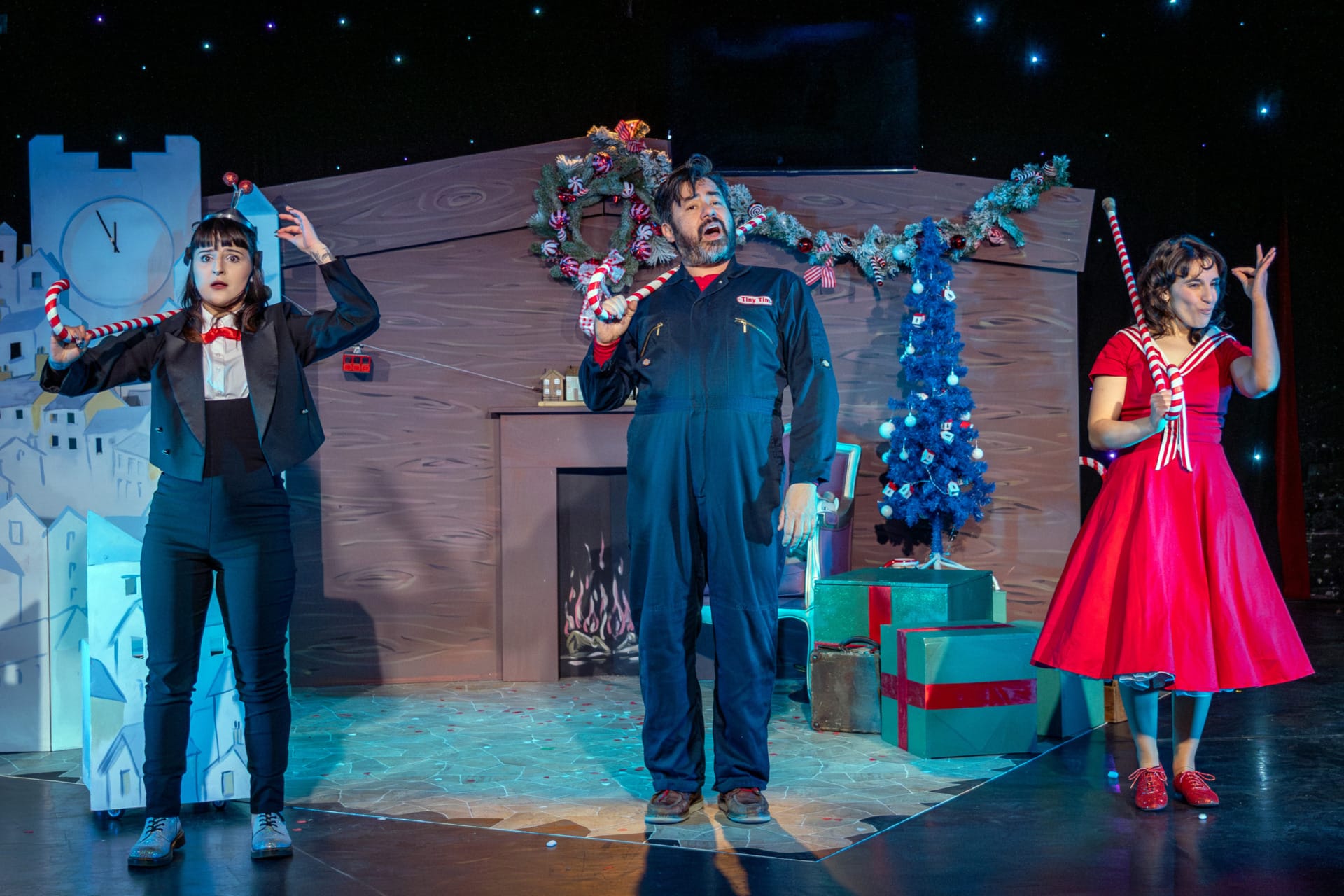 A robot, little girl and caretaker dancing with Christmas canes