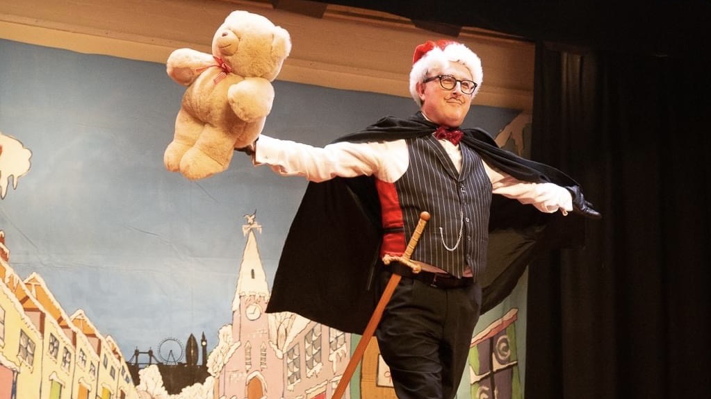 Richard as king rat holding a teddy bear out