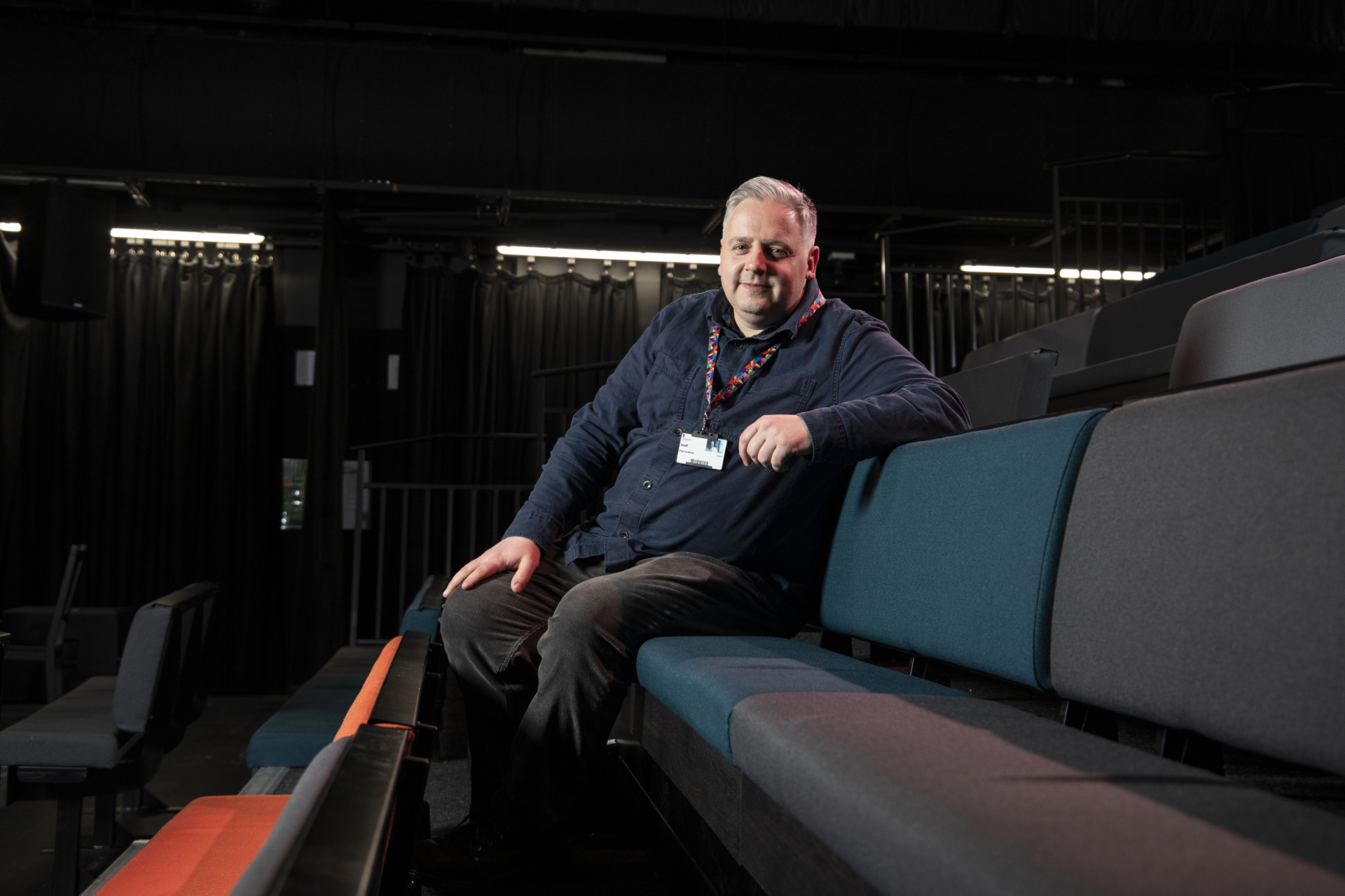 Paul sat in a university theatre
