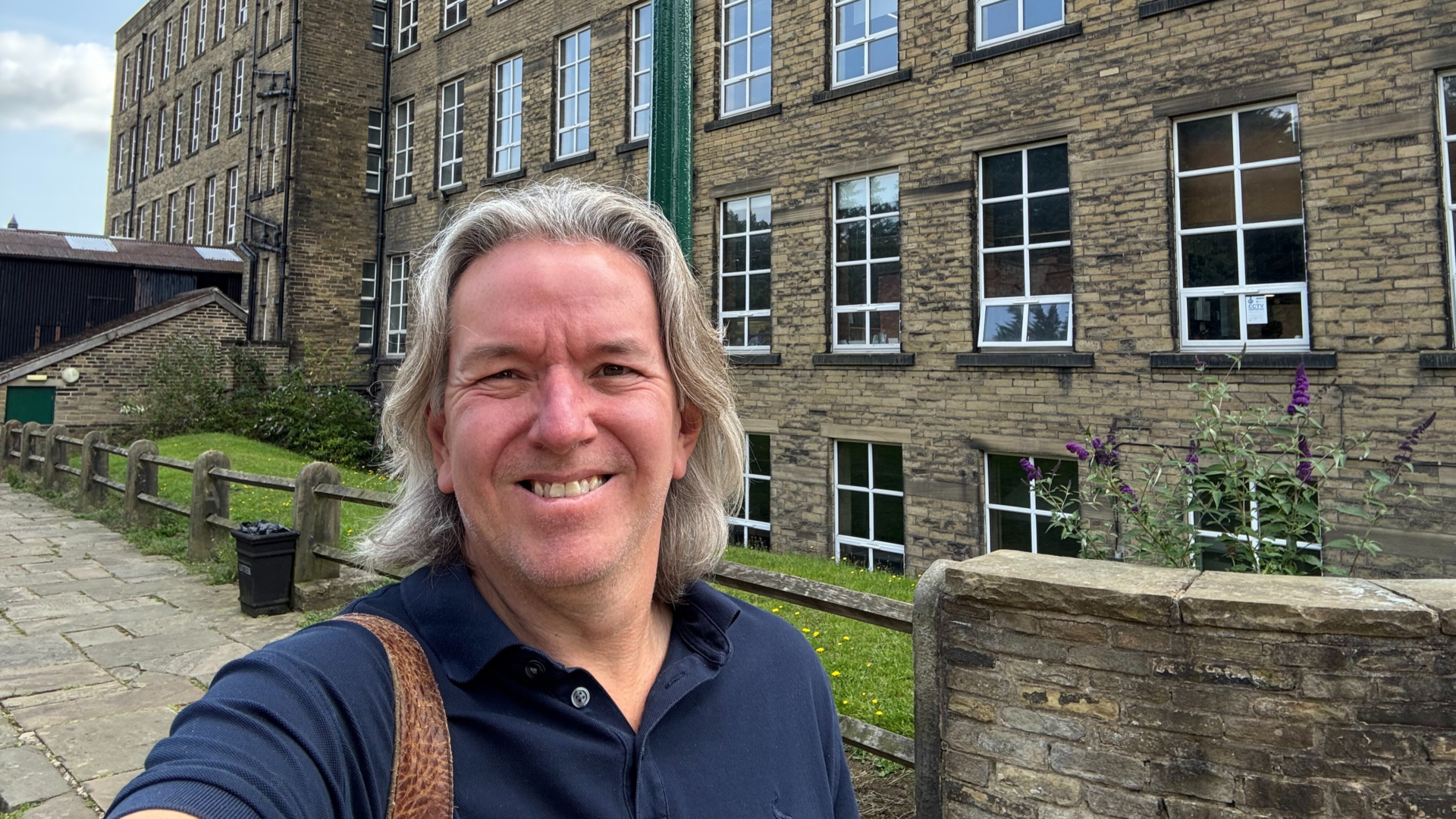 Chris taking a selfie outside a Victorian mill