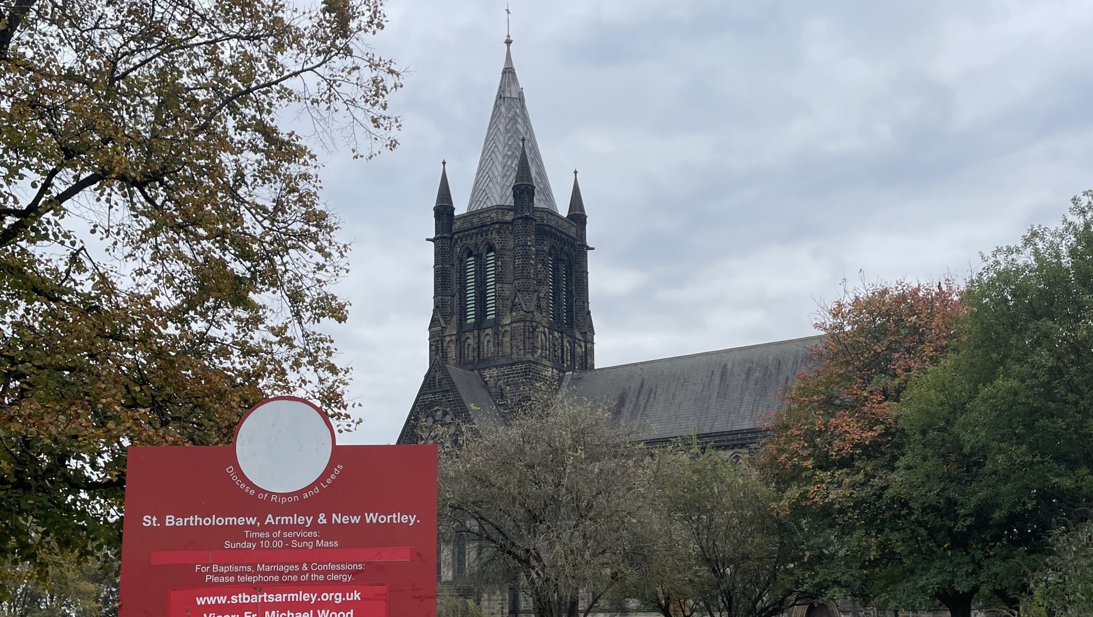 An 18th Century church with spire in autumn