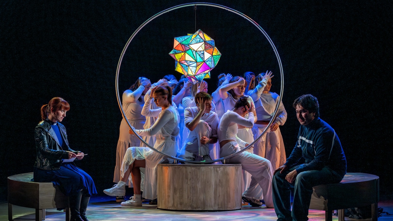 A vicar reads a letter to an asylum seeker in a church