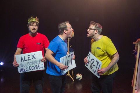 Three men with their names on signs mock arguing