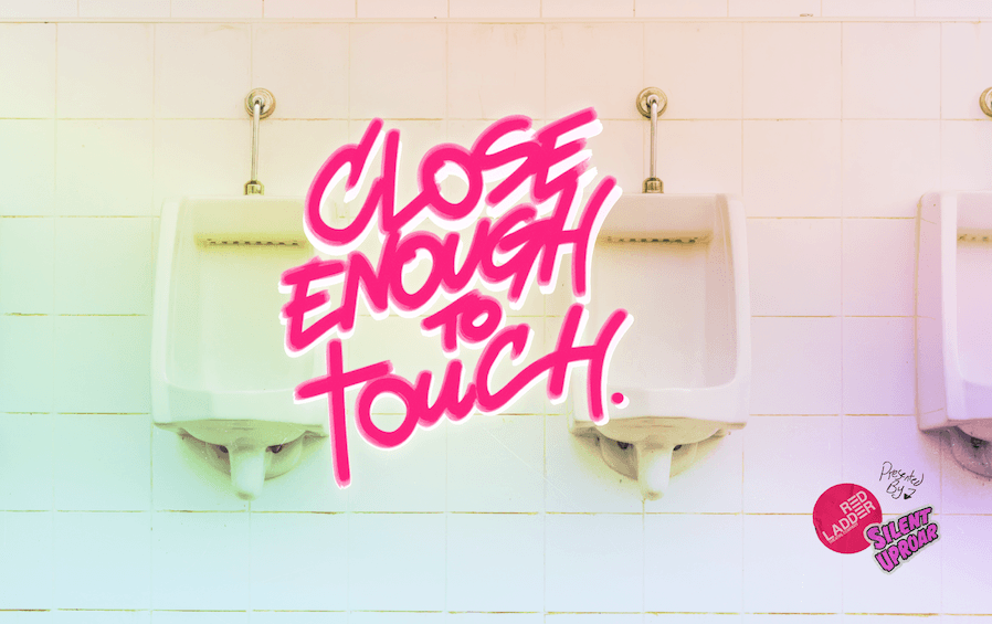 Close Enough To Touch graffittied on a urinal wall