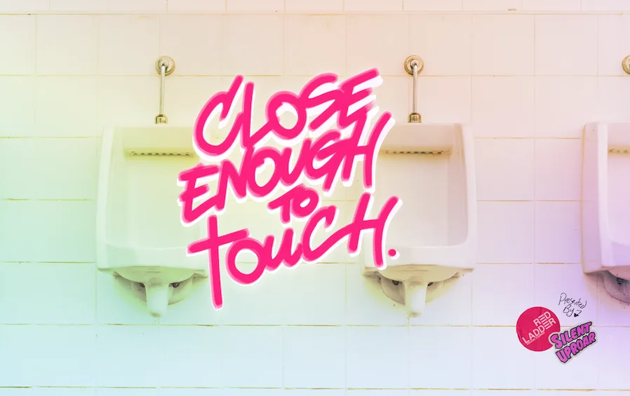 Close Enough To Touch graffittied on a urinal wall
