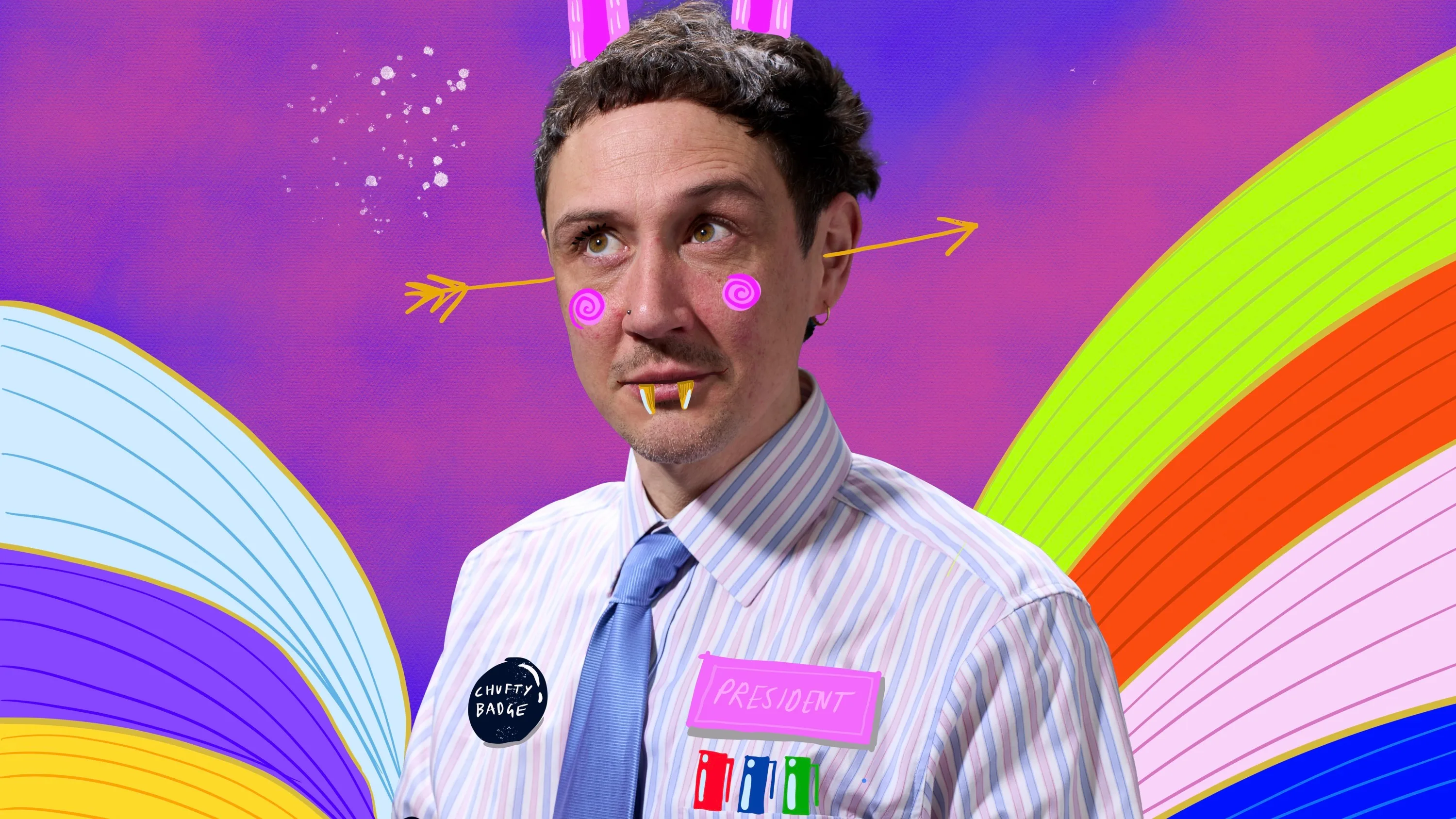 Scott with drawn on fangs, rabbit ears and googly eyes with a rainbow background