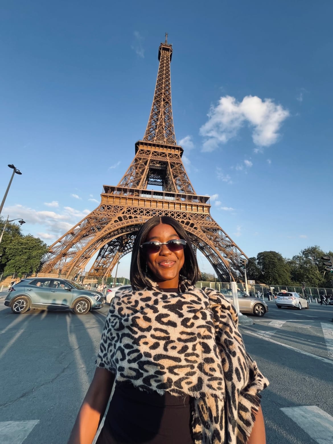 Linda-Ray stood smiling in front of the Eiffel Tower