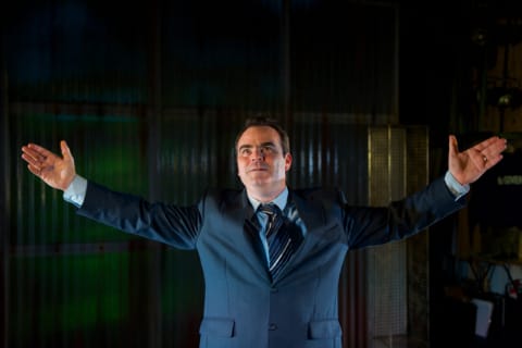 A man with both his hands to the sky.