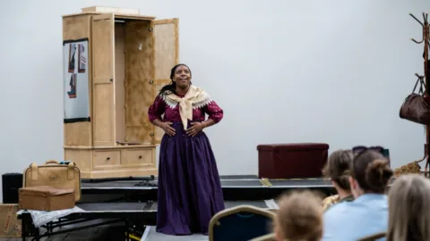 Alicia in dress and shawl
