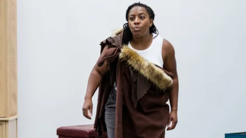Alicia in cave robes, hunting