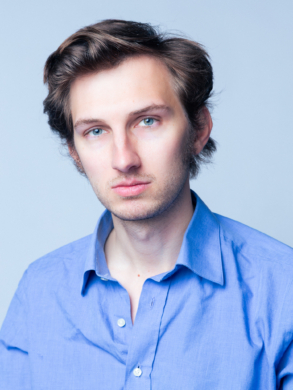 Henry in buttoned down blue shirt
